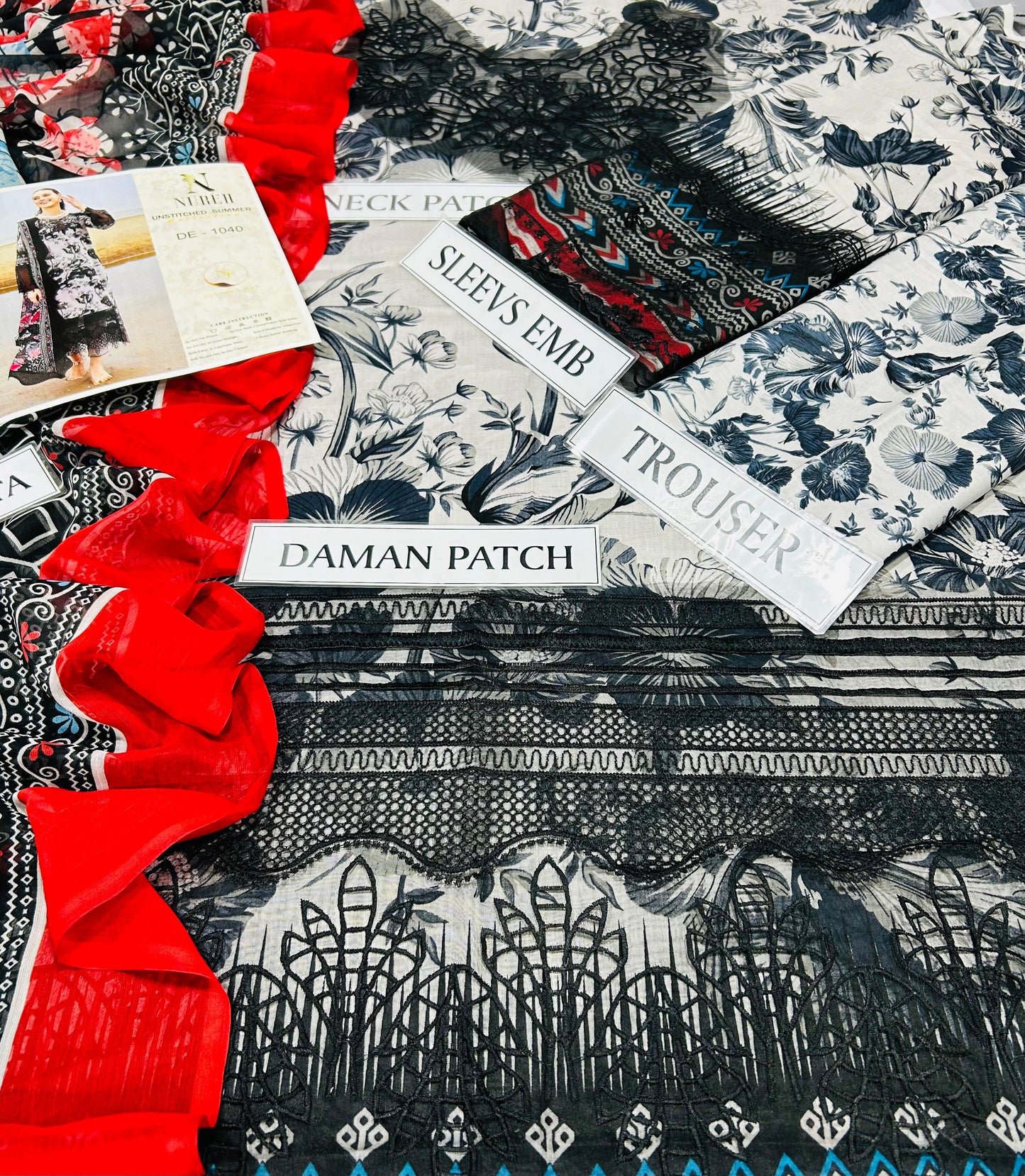 printed lawn front with heavy embroidered scifflie neckline with heavy embroidered spengle work daman boarder