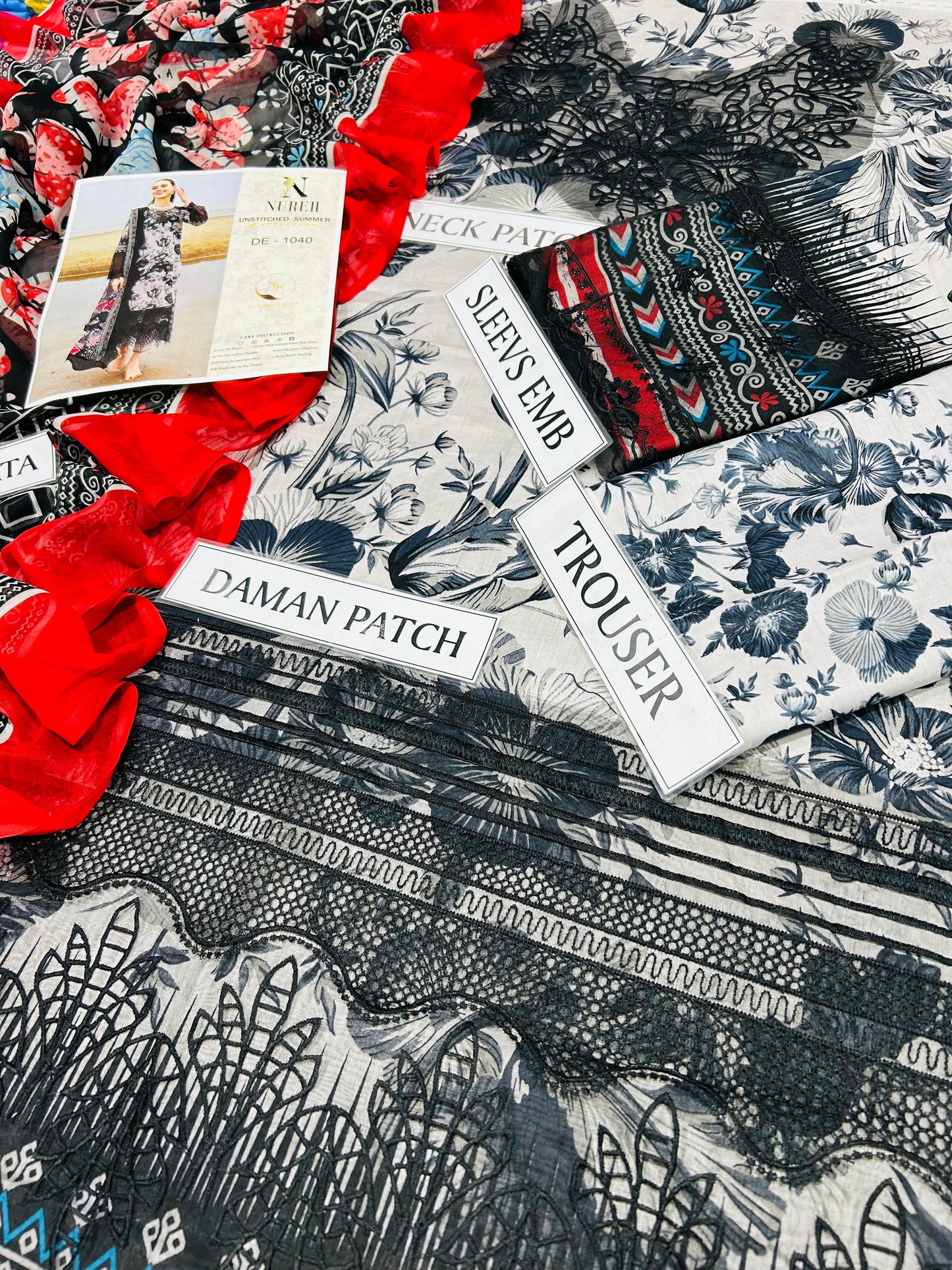 printed lawn front with heavy embroidered scifflie neckline with heavy embroidered spengle work daman boarder